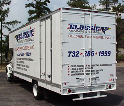 Classic Moving & Storage truck rear ramp lowered for loading