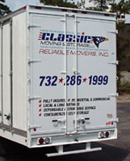 Rear view of a Classic Moving & Storage truck with doors open