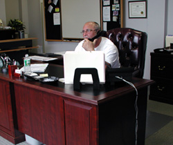 Jeff Brito, owner of Classic Moving & Storage, beside a company truck